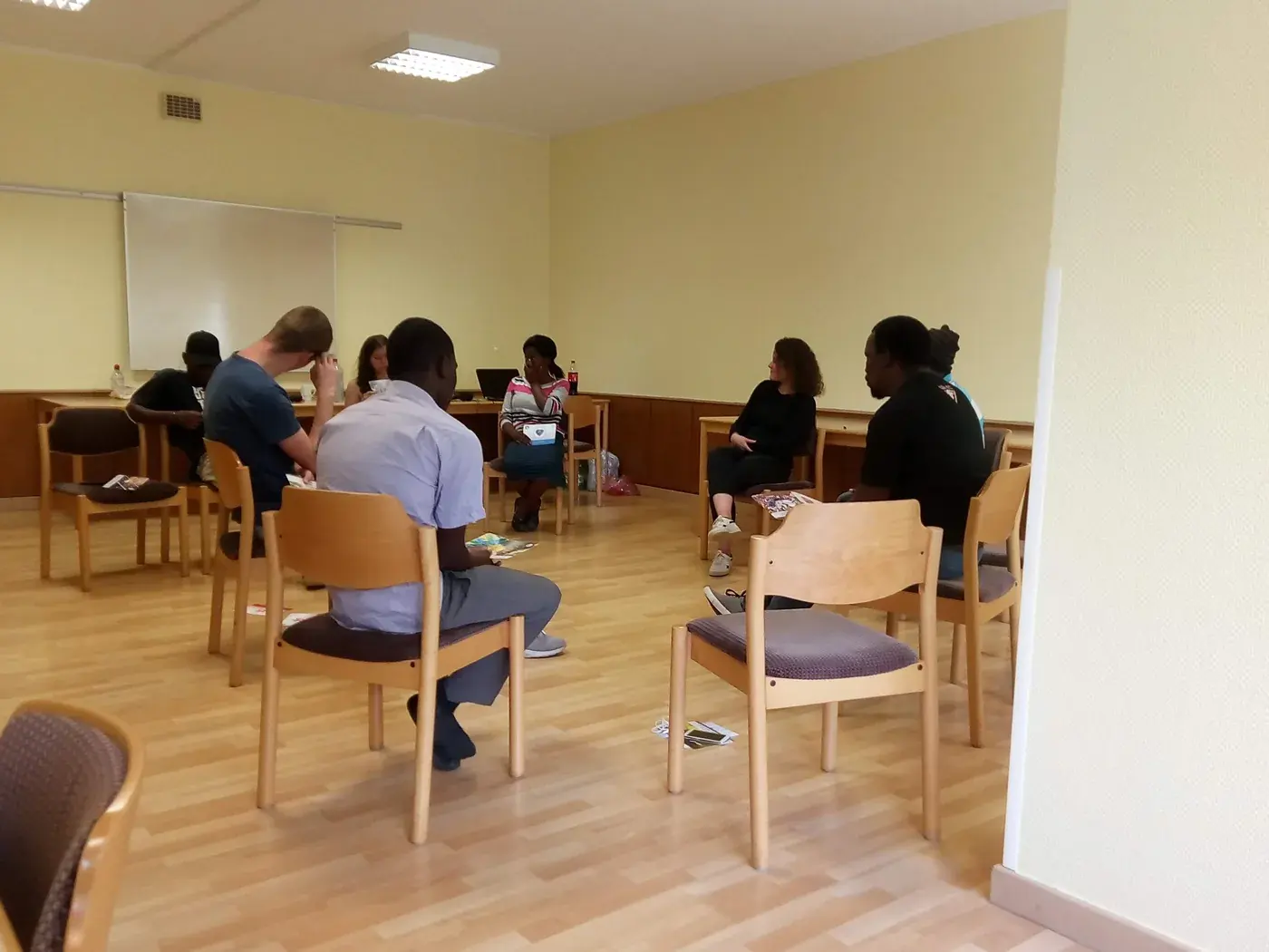 Young adults seated in a circle during an interactive workshop