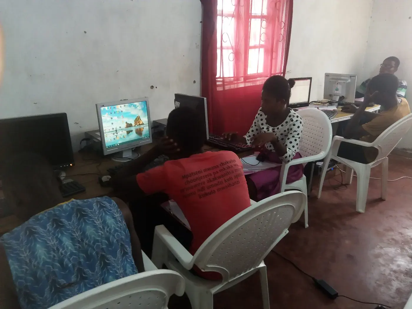 Participants receiving guidance while working at computers