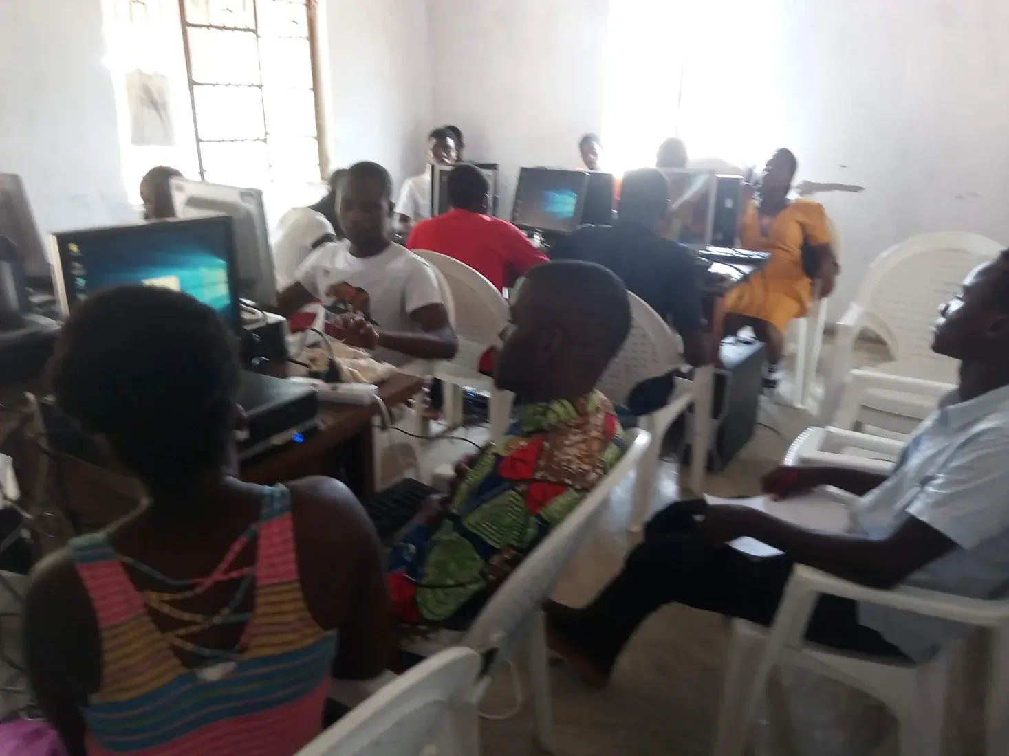 Participants working at desktop computers during a group training session