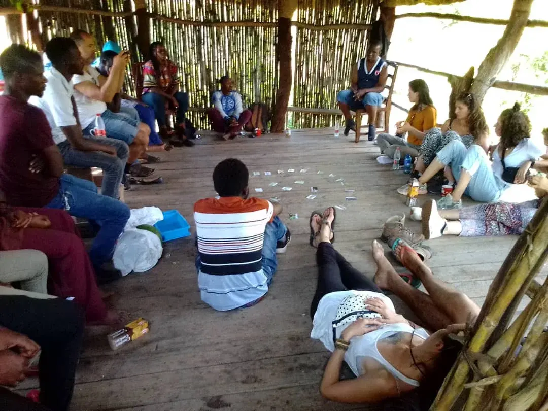 Youth workers gathered in a circle for a shared learning session in Malawi
